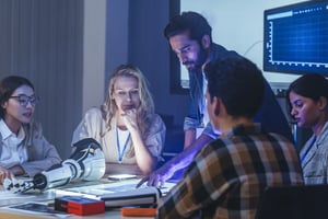 Diverse group of engineers and designers collaborates