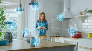 Internet_of_Things_Concept_Young_Woman_Using_Smartphone_in_Kitchen