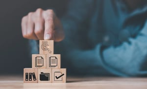 sHuman hands, wooden blocks and icons ,Concept of pre-approval quality assessment